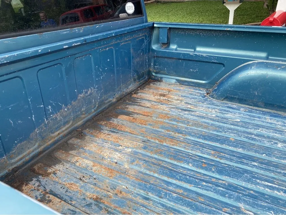 Rusty truck bed before restoration